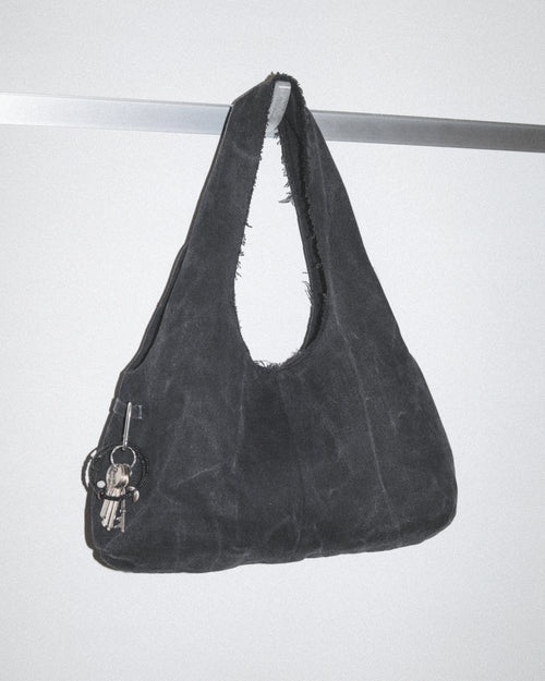 Black handbag made from black denim jeans with keys and bag charm